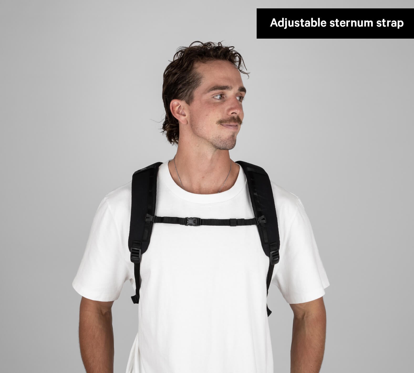 Everyday 22L backpack worn by model; Adjustable sternum strap label visible.