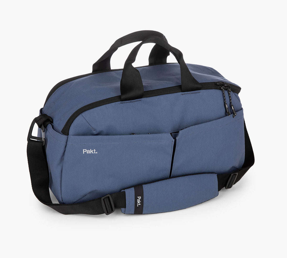 Blue 25L Pakt. travel duffel with top handles, shoulder strap, and front pockets