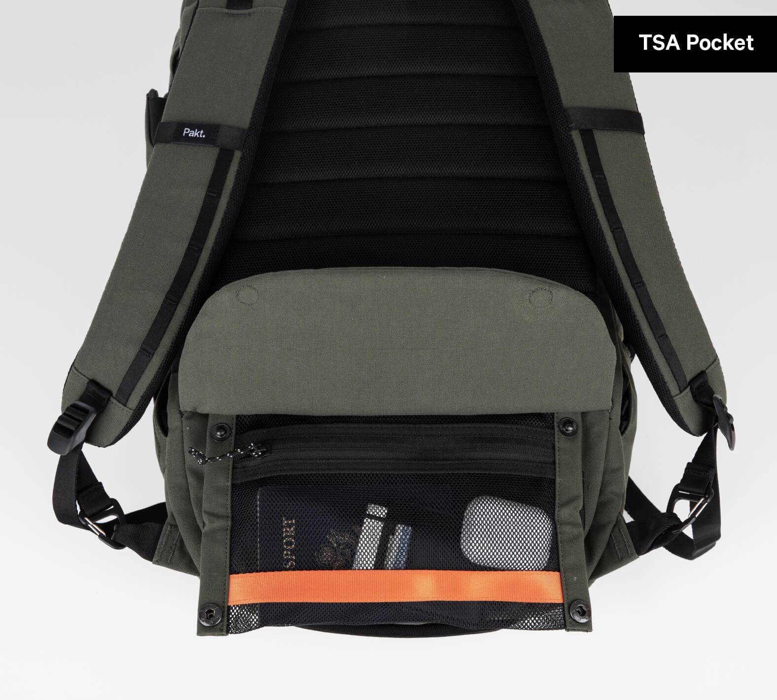 Backpack with open TSA Pocket showing passport, boarding pass, and small case inside.