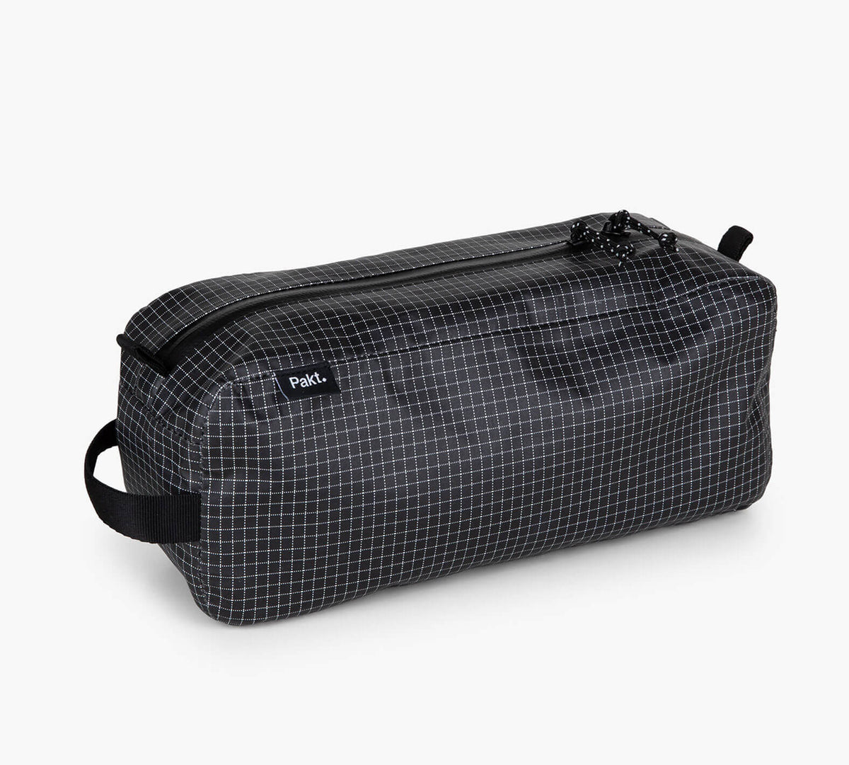 Black waterproof zip pouch with white grid pattern, side handle, label reading Pak.