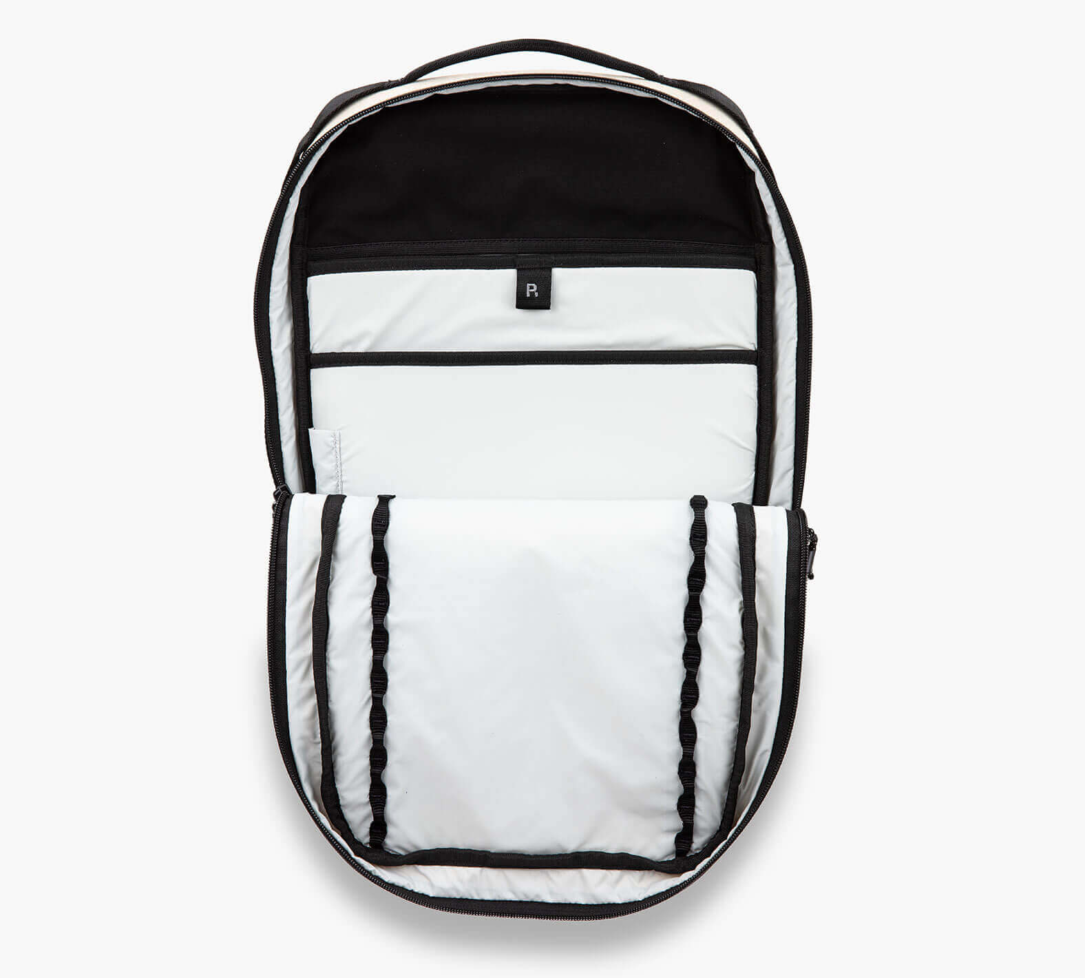 Showing the inside of the Everyday 15L Bag with zipper and compartments open.