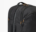 Black backpack top with dual zippers, padded carry handle, and front zippered pocket.