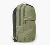 Three-quarter front view of Stash Packable Backpack 16L showcasing cypress recycled nylon and front zip pocket on white background