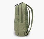 Olive green slim daypack, side profile showing vertical zip pocket, top zipper and padded shoulder straps.