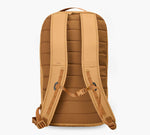 Back view of tan padded backpack with adjustable shoulder straps, sternum strap, and quilted back panel.