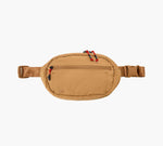 Tan packable sling bag with front zip pocket, red cord zipper pulls, adjustable strap