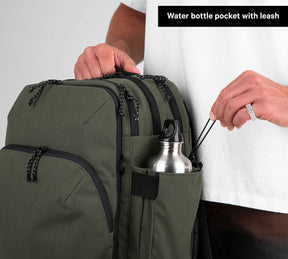Travel Backpack Green storage space demonstrated with water bottle