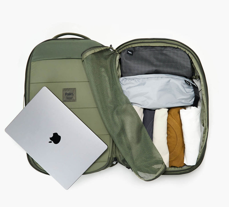 An overhead shot showing the interior of the Aero Travel Backpack in Cypress.