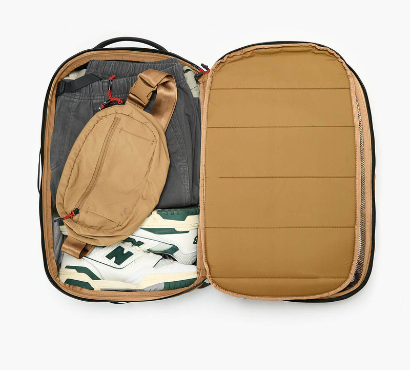 An overhead shot showing the interior of the Aero Travel Backpack in Black.