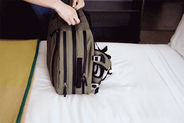 backpack unzipping and opening with clamshell design