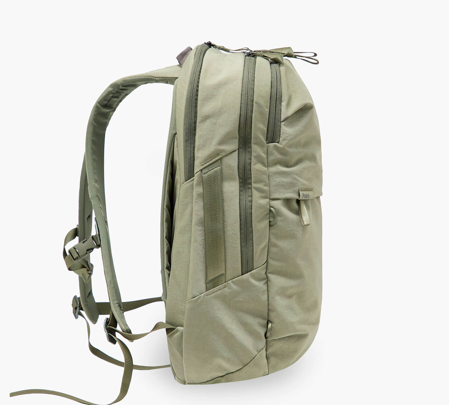 Side profile of MODE Backpack 22L in Cypress showcasing padded shoulder straps and zippered main and front compartments on white background