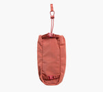 Centered front view of MODE Bottle Sleeve in Sumac showing adjustable hanging strap and two quick-release buckles on white background