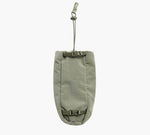 Front view of MODE Bottle Sleeve in Cypress showing buckle-fastened roll-top closure and adjustable hanging strap on white background