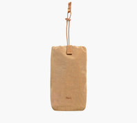Tan bottle sleeve with adjustable cord strap and Pakt. logo