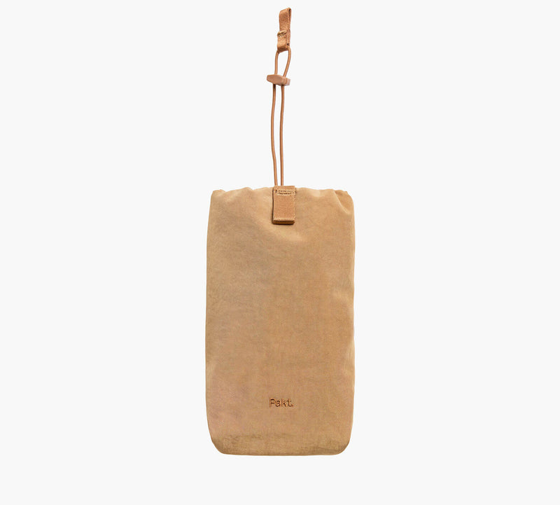 Tan bottle sleeve with adjustable cord strap and Pakt. logo