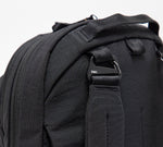 Black backpack shoulder strap with metal clip labeled 'Pakt.'