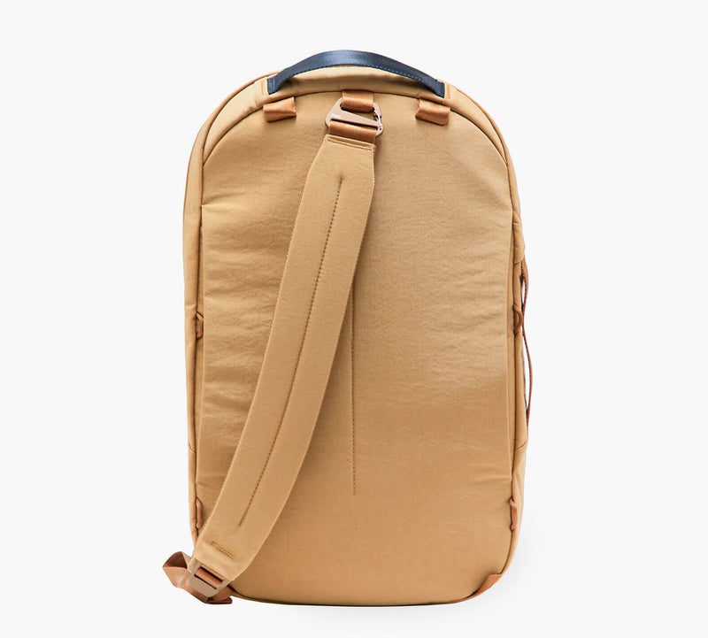 tan backpack backside with padded single shoulder strap and top leather handle
