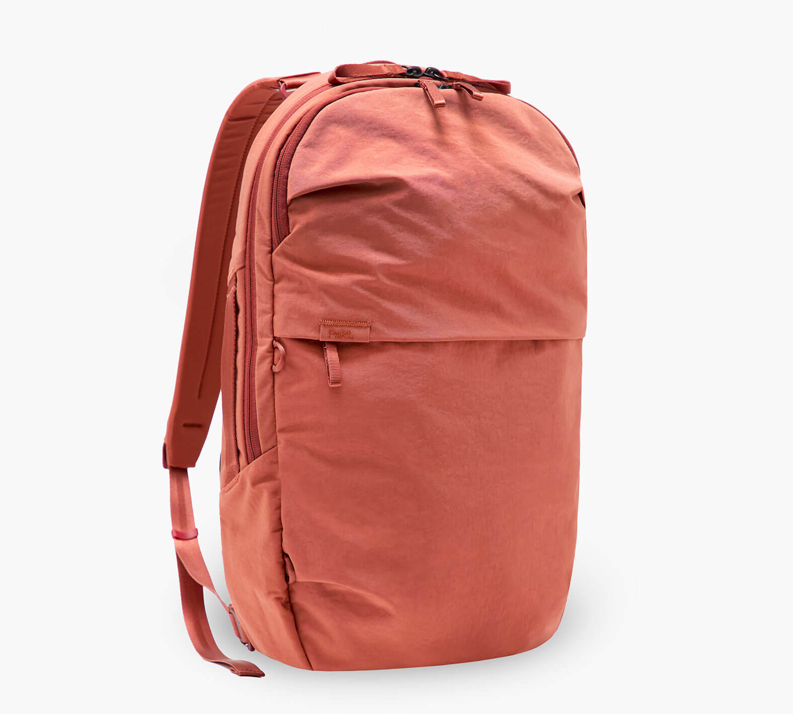 coral backpack with front zip pocket and side water-bottle pocket, three-quarter view