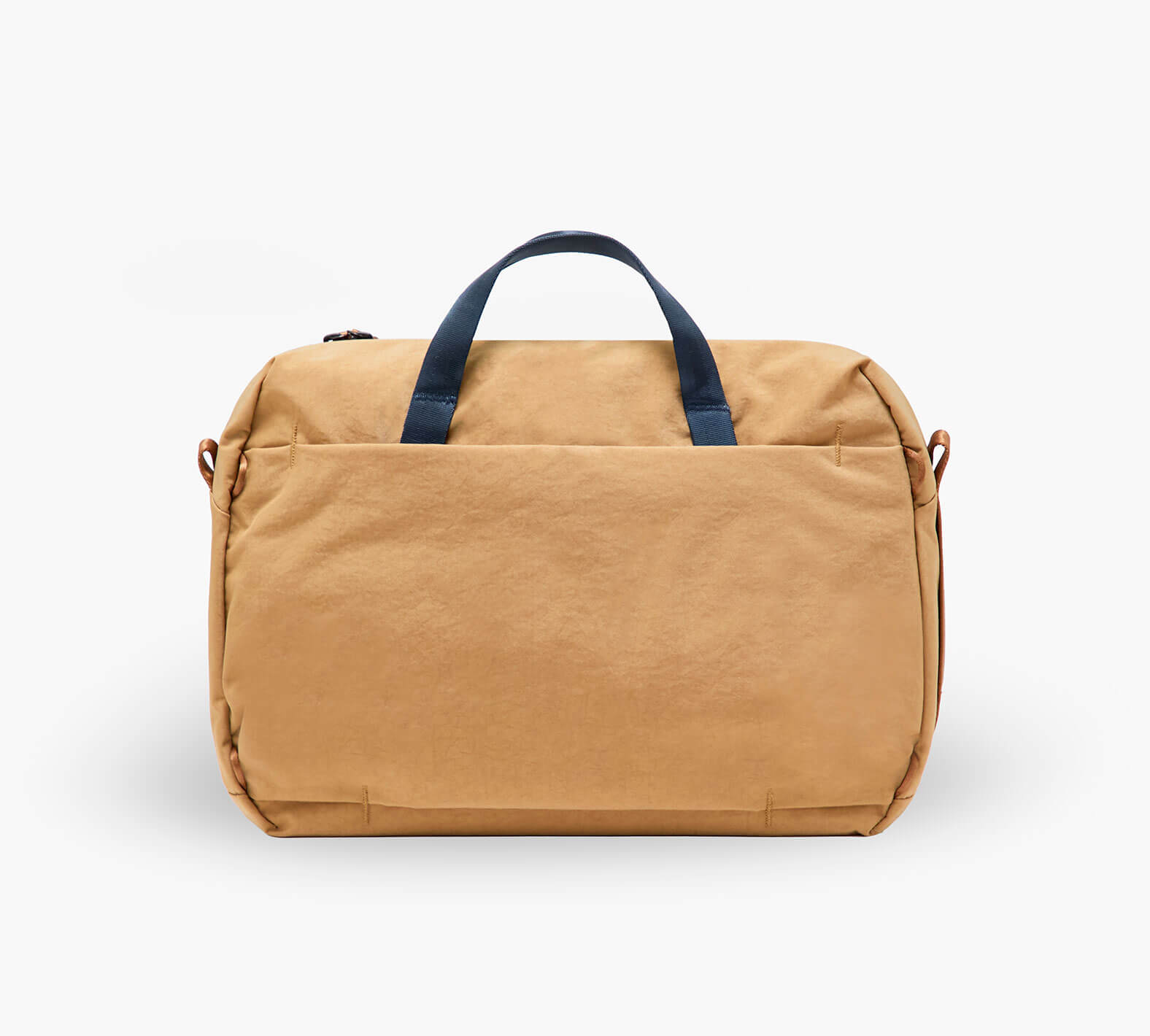 Front view of MODE Shoulder Bag 12L in Mojave showing large front pocket and navy top handles on white background