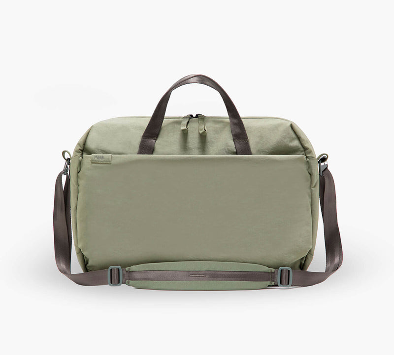 Olive-green weekend duffel with leather top handles, front zip pocket and adjustable shoulder strap