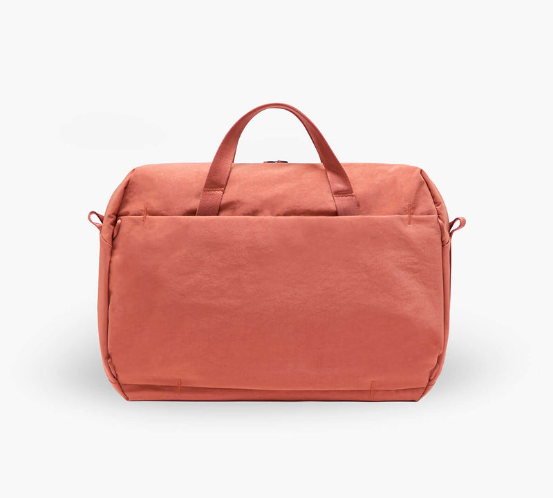 Coral travel duffel bag with top handles and front pocket