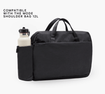 Black bottle sleeve attached to Mode 12L shoulder bag; text reads 'COMPATIBLE WITH THE MODE SHOULDER BAG 12L'