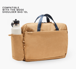 Tan bottle sleeve on Mode 12L shoulder bag with white bottle — COMPATIBLE WITH THE MODE SHOULDER BAG 12L; Pakt.