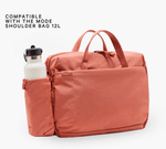 COMPATIBLE WITH THE MODE SHOULDER BAG 12L — coral Mode shoulder bag with insulated side bottle sleeve holding white bottle