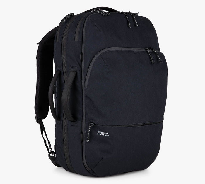 Black Pakt. travel backpack with front zip pocket and padded shoulder straps