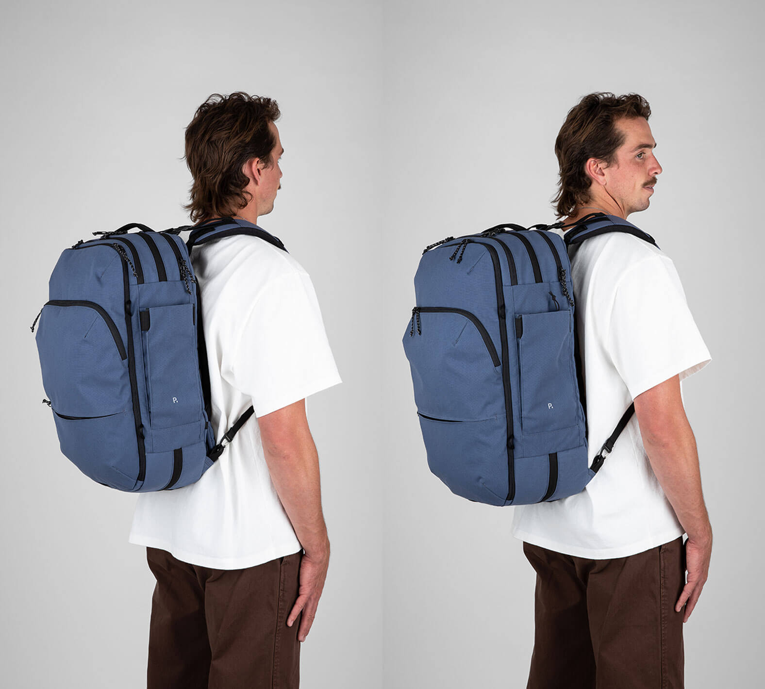 man wearing blue travel backpack