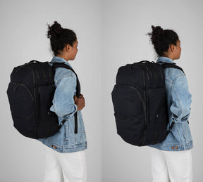 Woman wearing black travel backpack