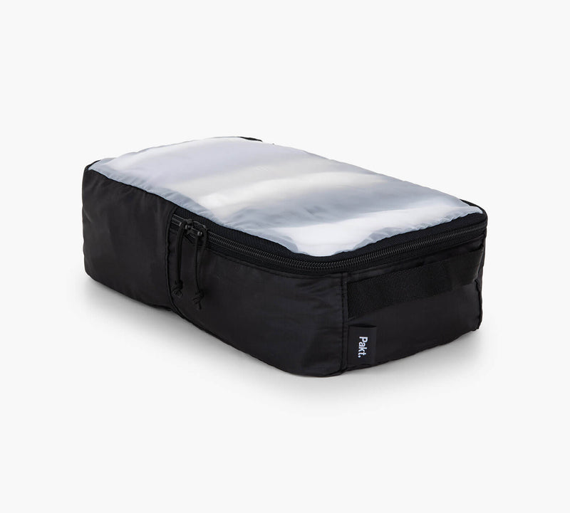 Black rectangular packing cube with clear top panel and zippered side pocket