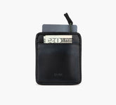 Black slim leather cardholder with pull-tab, showing a card and a visible bill marked "20" in the front pocket.