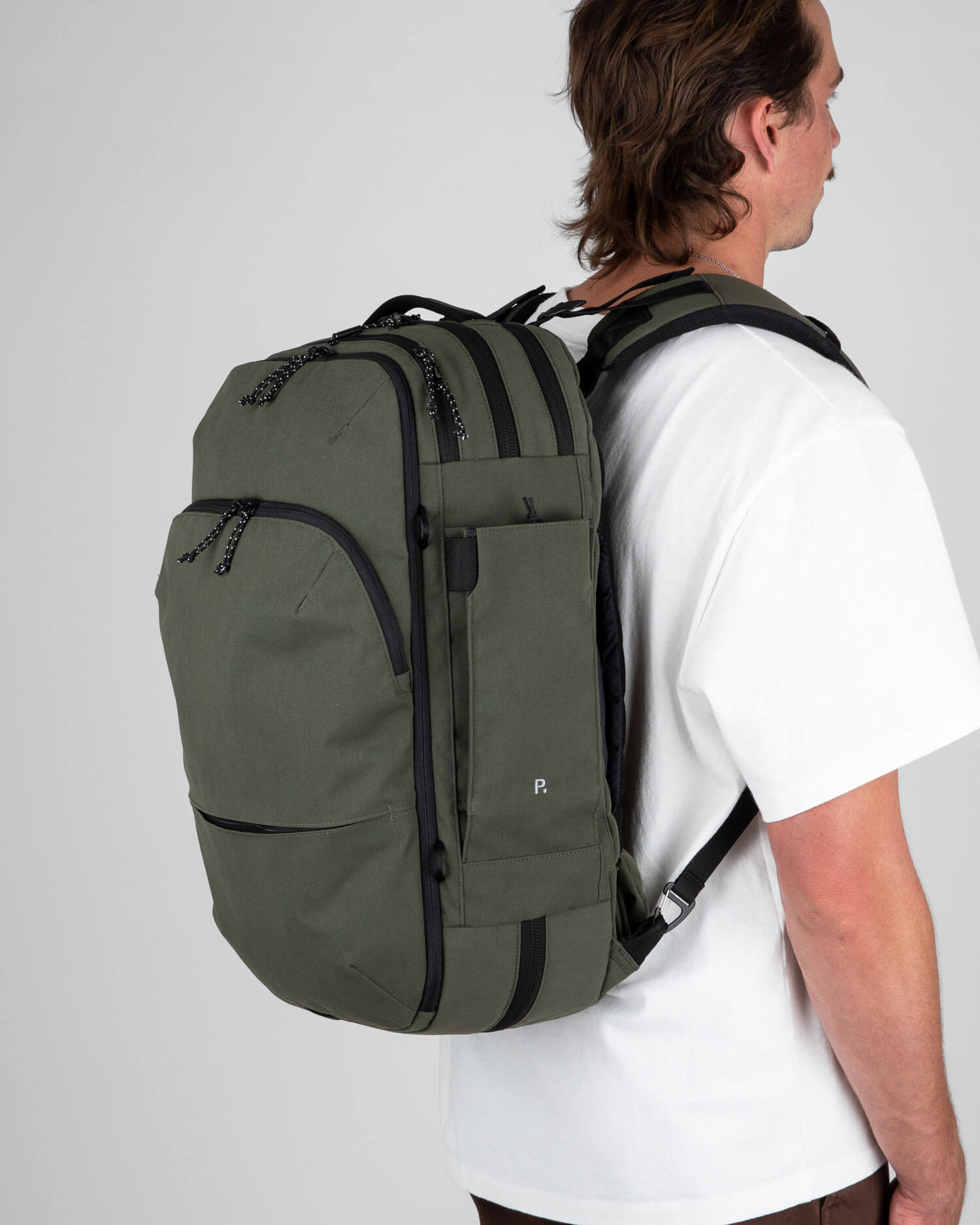 Man carrying green backpack
