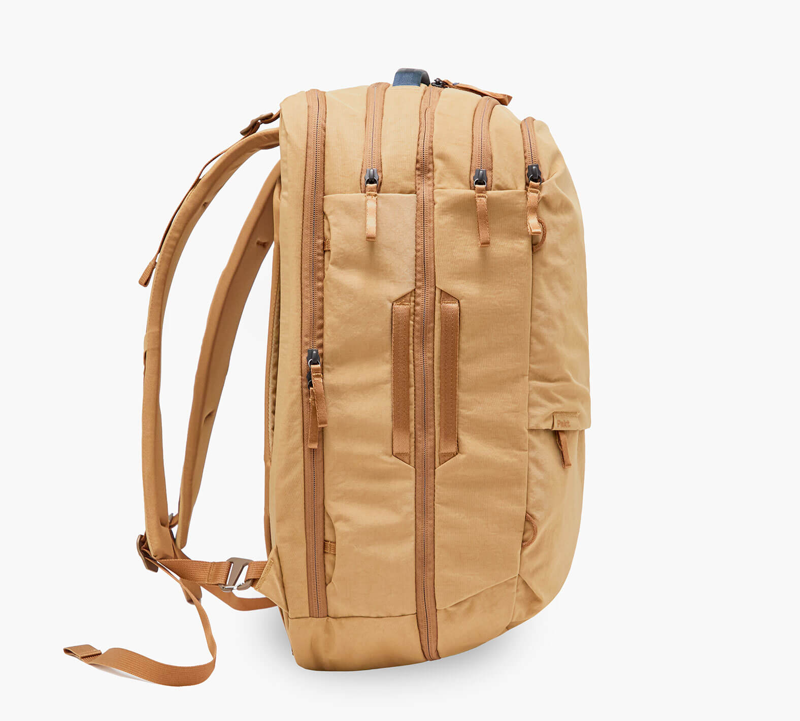 Tan backpack, side view with padded shoulder straps, two vertical zippered pockets and leather-look strap detail.