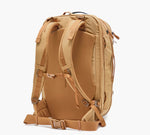Tan travel backpack, rear view showing padded shoulder straps, lumbar padding, hip belt, and sternum strap