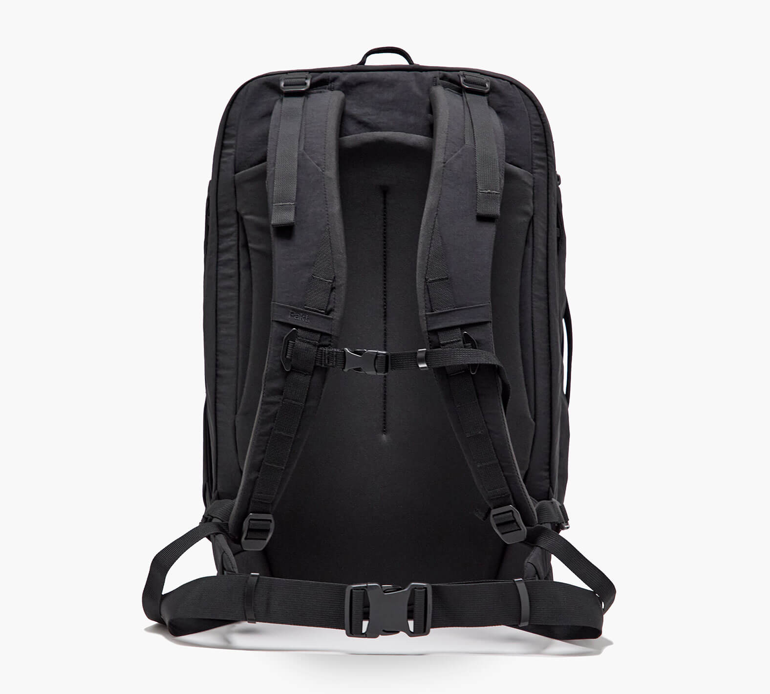 Black technical backpack viewed from the back with padded shoulder straps, sternum strap, and hip belt.