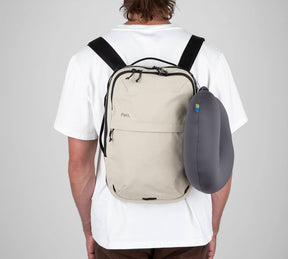 Man with tan sling backpack