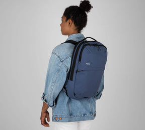 Woman with sling backpack blue