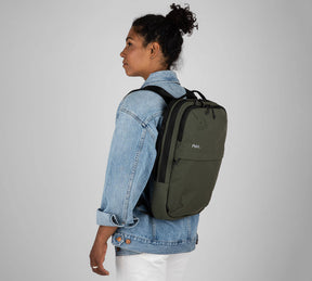 Woman with sling backpack green