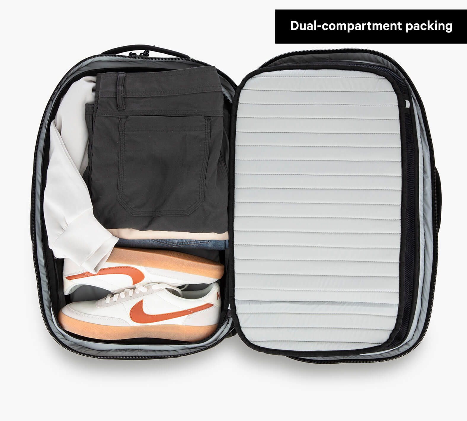 Travel Backpack Grey storage space demonstrated holding tennis shoes and clothes