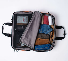 pack clothes into one half of the large interior compartments