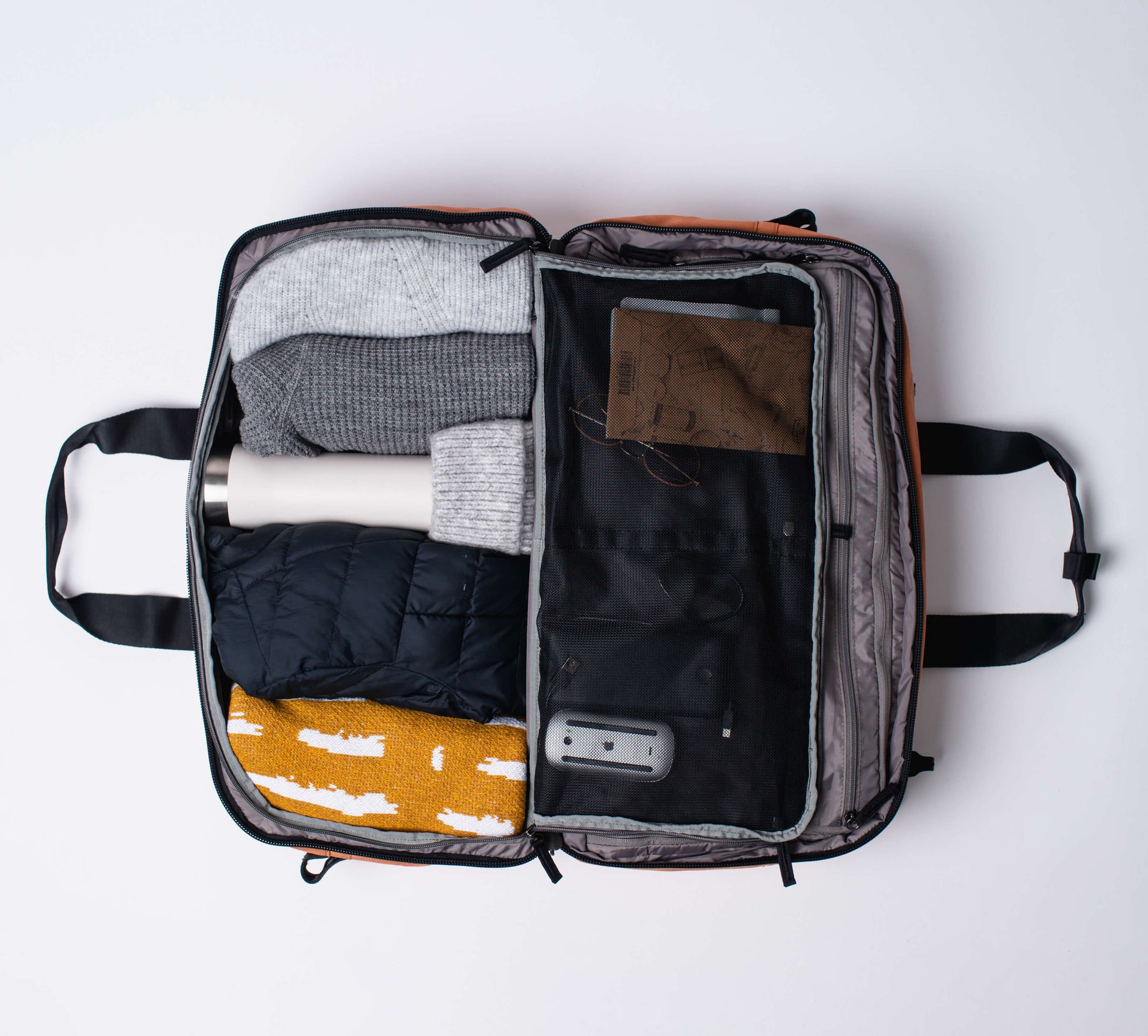 each side of the 50L backpack/duffel can be packed with clothing and other travel essentials