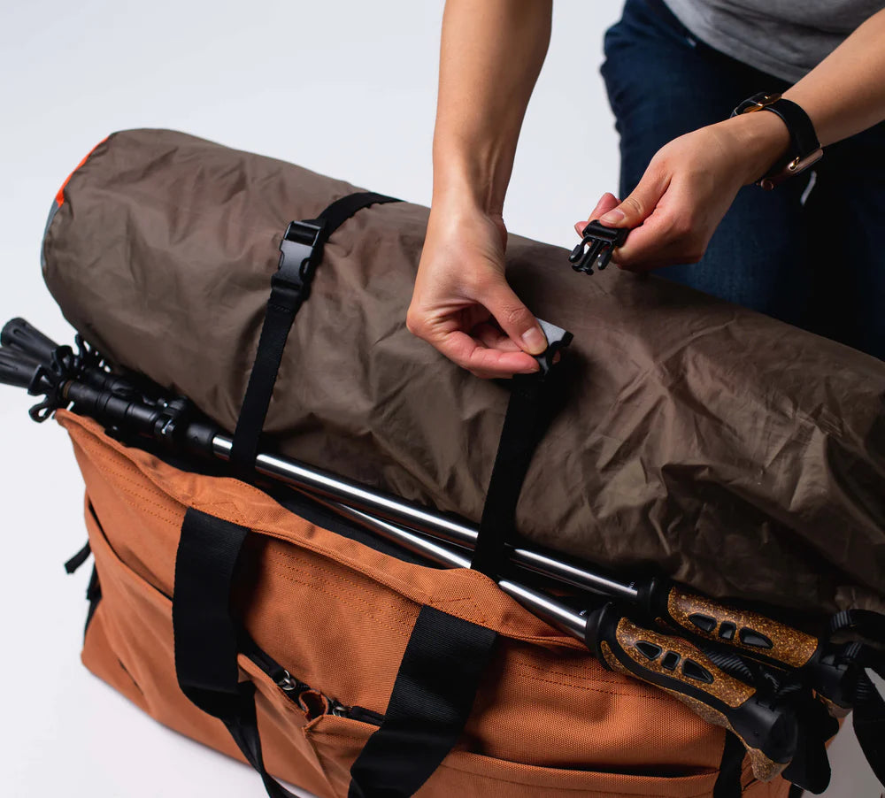 exterior accessory straps attach bulky items to the bag, like hiking poles and camping equipment 