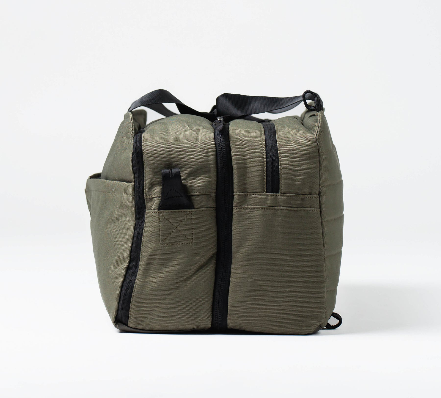 side-view of the 50L travel bag in green