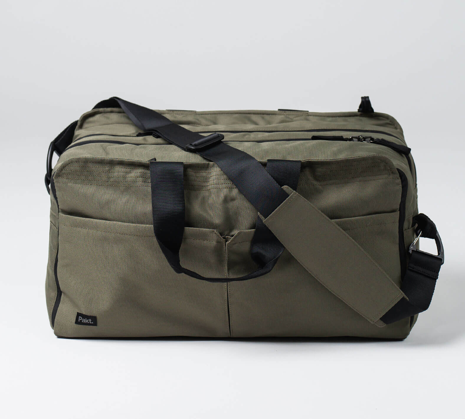 the 50L anywhere bag in green with a matching, padded shoulder strap