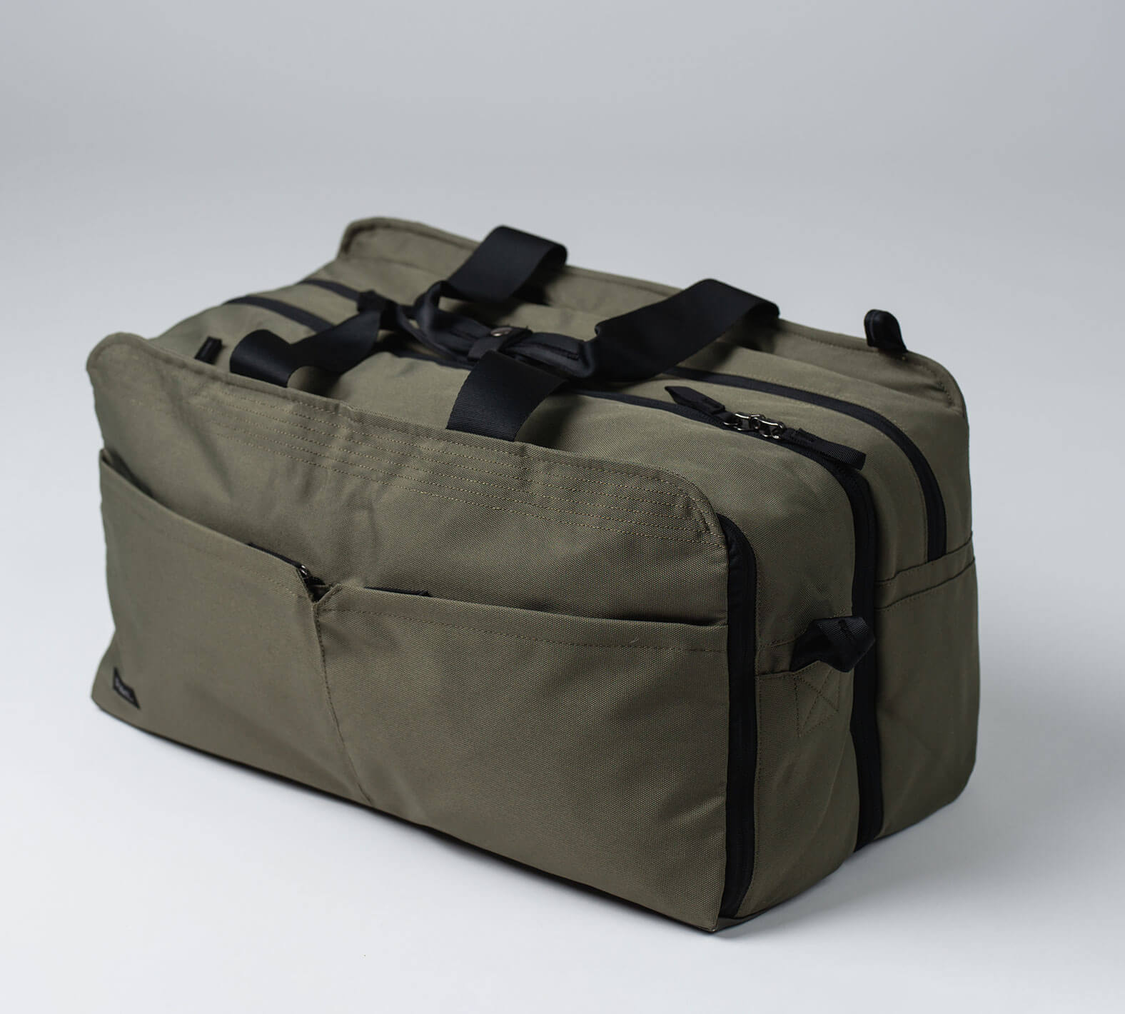 The front of the green 50L anywhere duffel/backpack