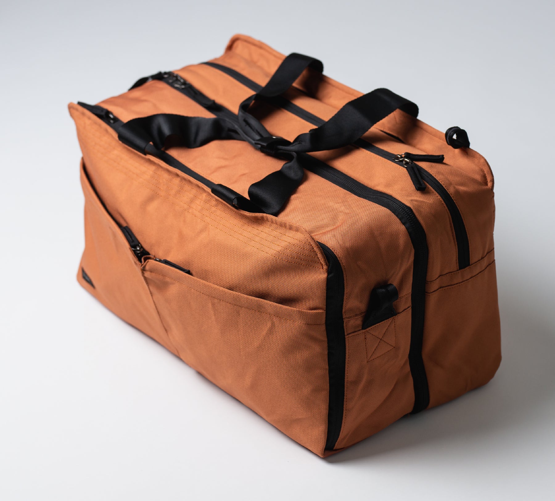 the 50L Backpack/duffel hybrid bag in adobe