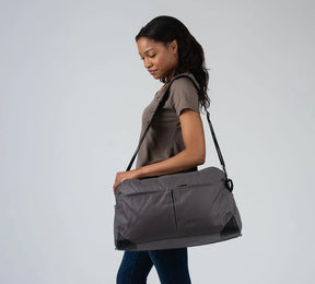 female model with the pakt one duffel