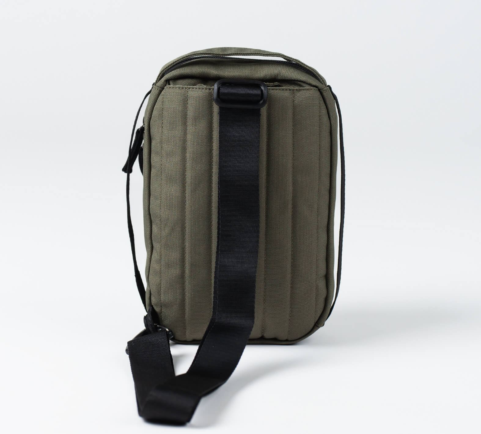 The back of the 5L Anywhere Sling in Green 